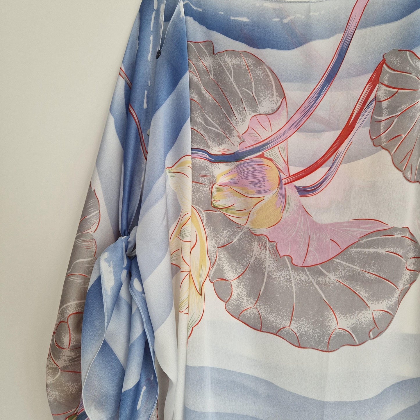 Handmade Boho-style multi-wear kaftan. Coloured with a lotus flower and blue waves coloured robe, with botanical, made from a soft cotton-polyester blend