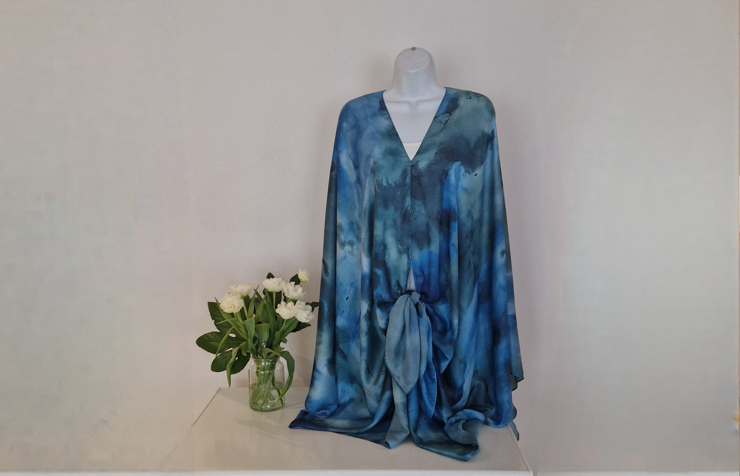 Handmade Boho-style multi-wear kaftan and robe in blue with golden border and botanical cherry blossom print, made from a soft cotton-polyester blend