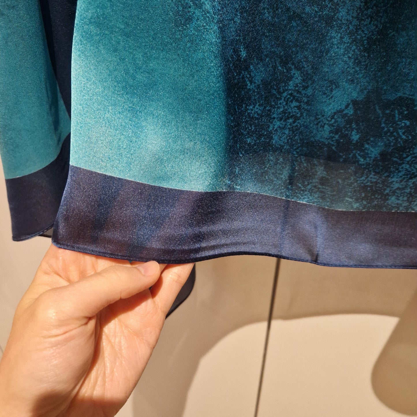 handmade boho-style multi-wear kaftan coloured with cherry blossom turquoise, with navy blue and botanical, made from a soft cotton-polyester blend  