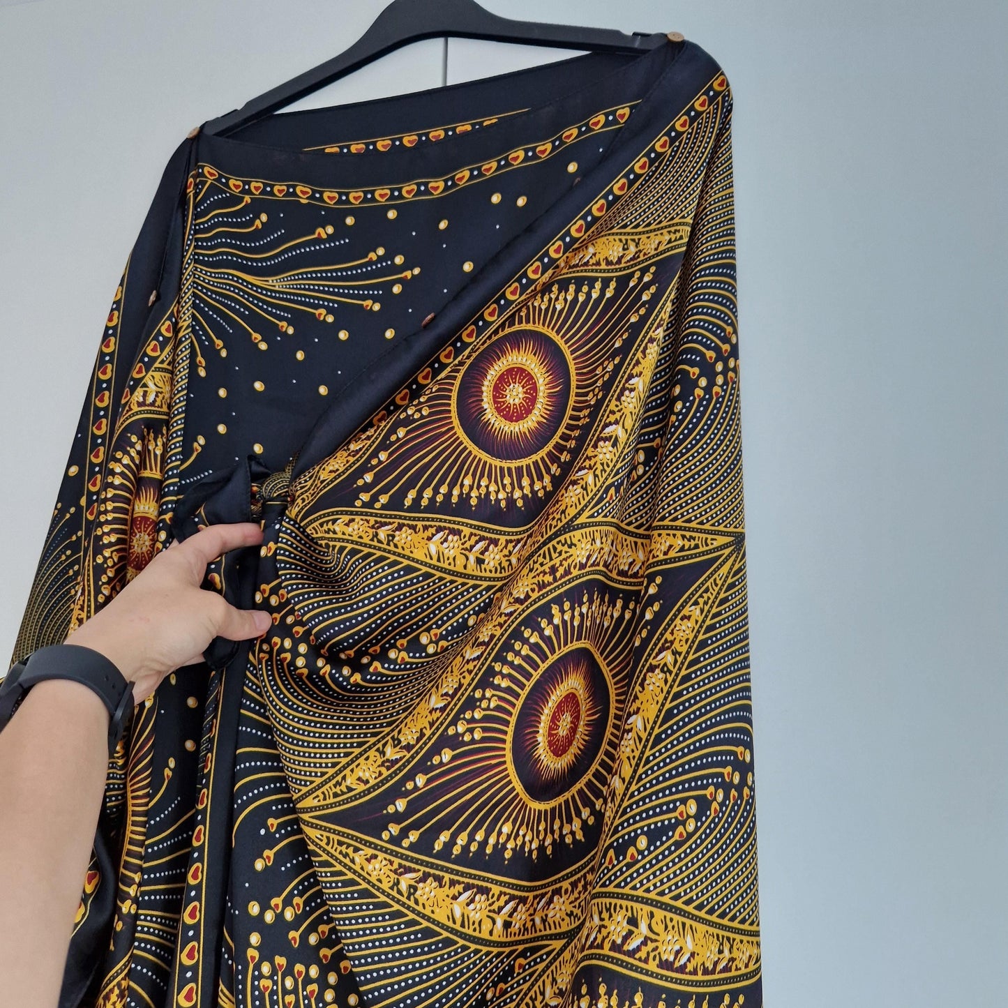 Handmade Boho-style multi-wear kaftan,  black robe, and gold details with botanicals are made from a soft cotton-polyester blend.
