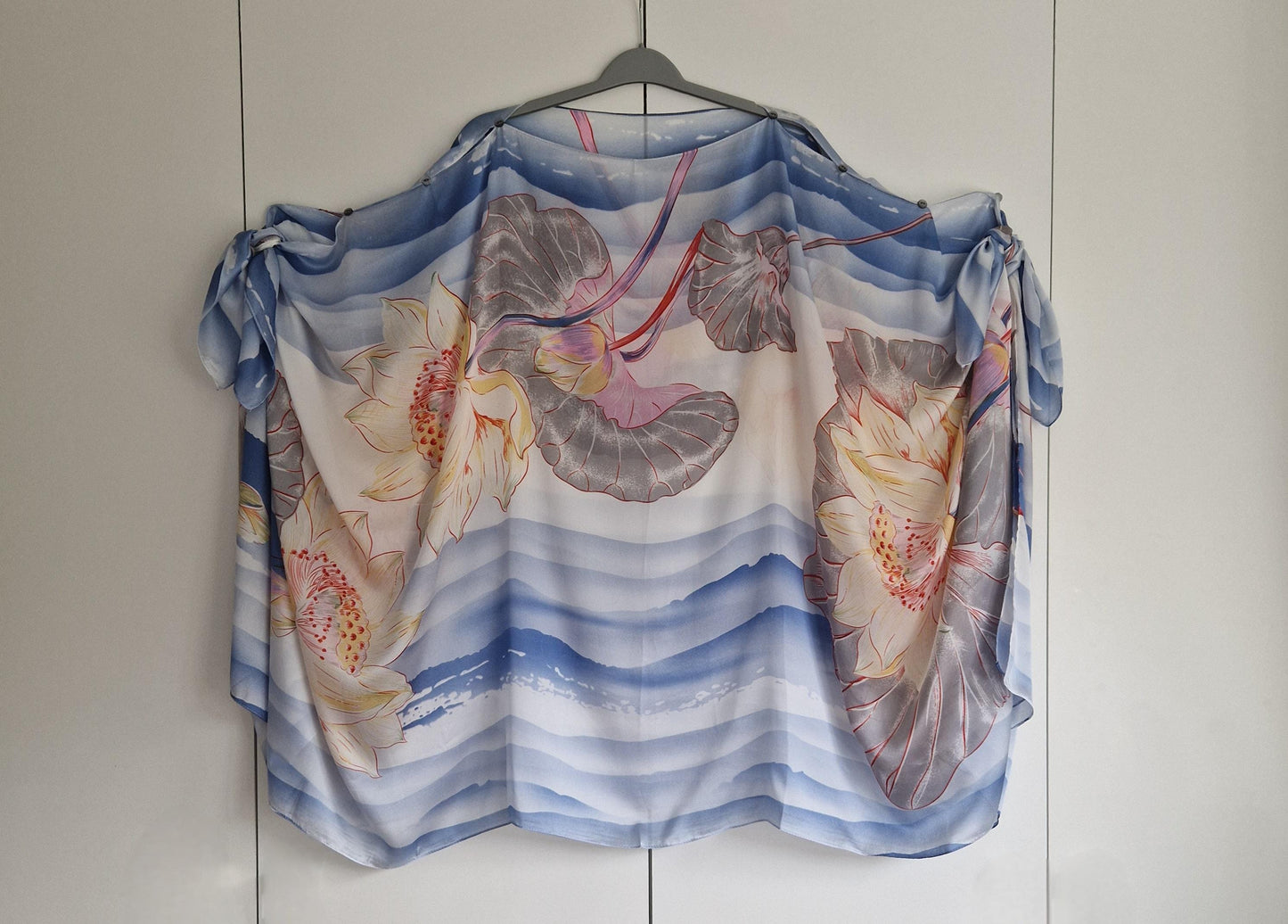 Handmade Boho-style multi-wear kaftan. Coloured with a lotus flower and blue waves coloured robe, with botanical, made from a soft cotton-polyester blend