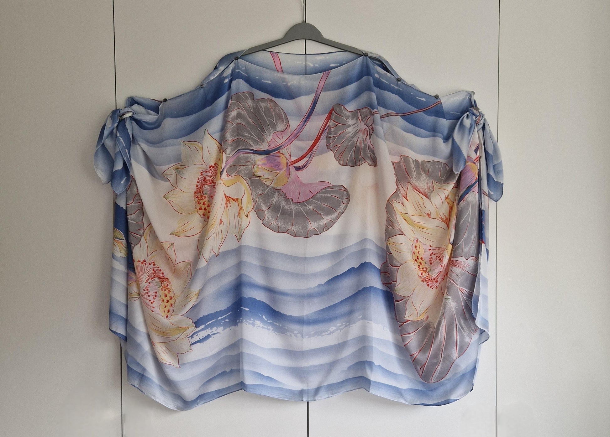 Handmade Boho-style multi-wear kaftan. Coloured with a lotus flower and blue waves coloured robe, with botanical, made from a soft cotton-polyester blend
