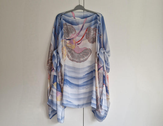 Handmade Boho-style multi-wear kaftan. Coloured with a lotus flower and blue waves coloured robe, with botanical, made from a soft cotton-polyester blend